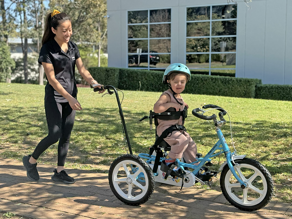 Lauren with Kyro on race runner bike